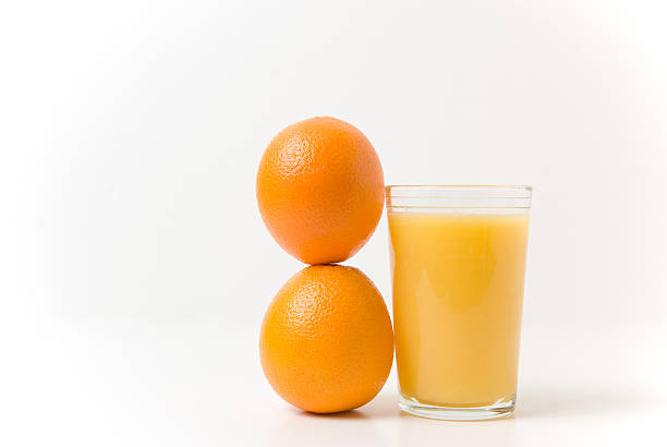 istock Orange juice with two fresh oranges 172700193