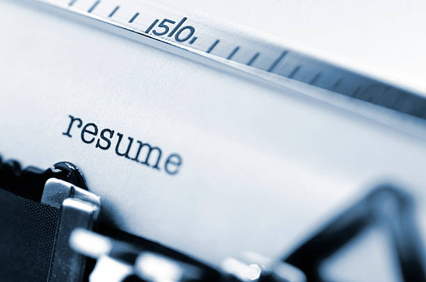 istock White paper in a typewriter with the word resume typed. 172701220