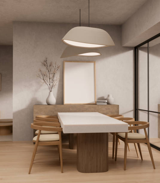 A modern Scandinavian dining room interior design with a minimal dining table with wooden armchairs.