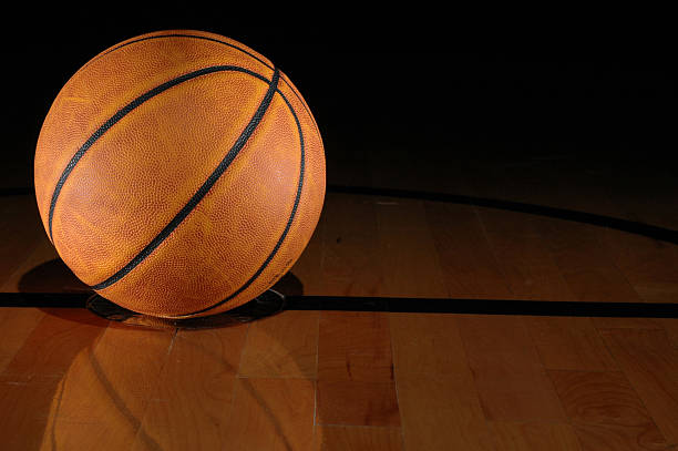istock Basketball on a Hardwood Gym Floor 172701306