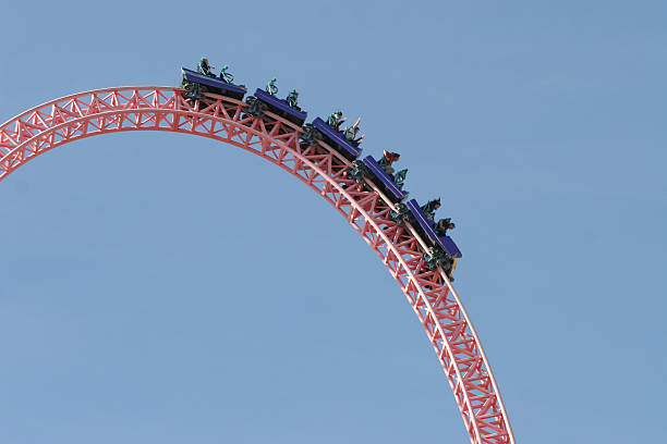 people on a rollercoaster - lunapark treni stok fotoğraflar ve resimler