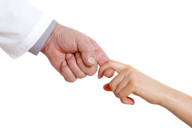 Lend assistance Doctor's hand and girl's hand stretched towards each other. Isolated on white godspeed stock pictures, royalty-free photos & images