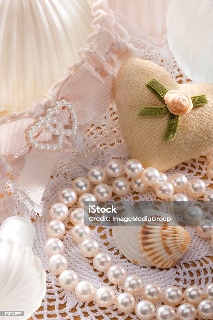 Newlywed Pearls and garder belt on vanity with copy space Animal Shell Stock Photo