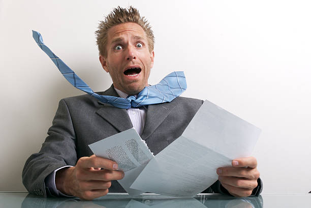 Office Worker Businessman Opening Letter with Expression of Stress