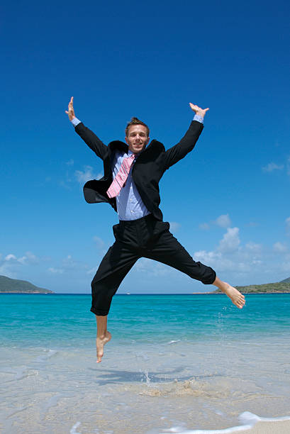 istock Happy Businessman Doing Spreadeagle Jump on Beach 172704173