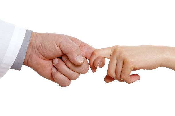 Lend assistance Doctor's hand and girl's hand stretched towards each other. Isolated on white godspeed stock pictures, royalty-free photos & images