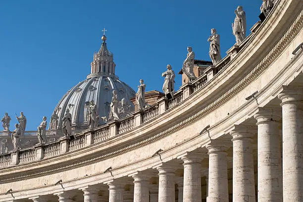 View of the dome of St. Peter's Basilica over the Collonade of St. Peter's Square