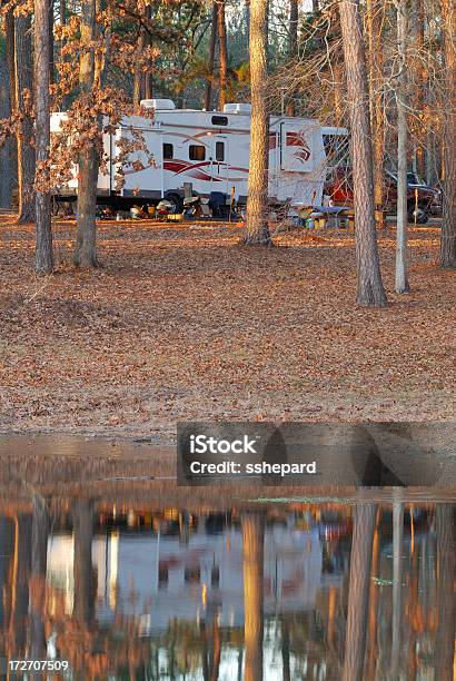 Fifth Wheel Reflecting In Lake Stock Photo - Download Image Now - Number 5, Wheel, Autumn