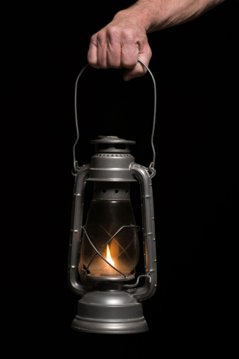 Old style lantern being held by masculine hand.Also available:
