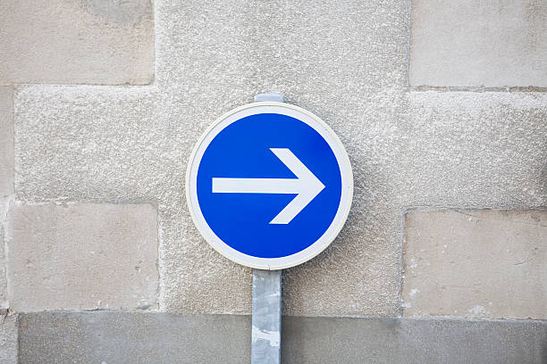 istock One way sign against limestone wall 172707668