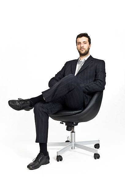 istock business manager sitted on black armchair 172708314