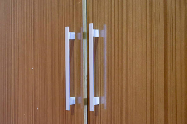 a door handle on a wooden wardrobe,