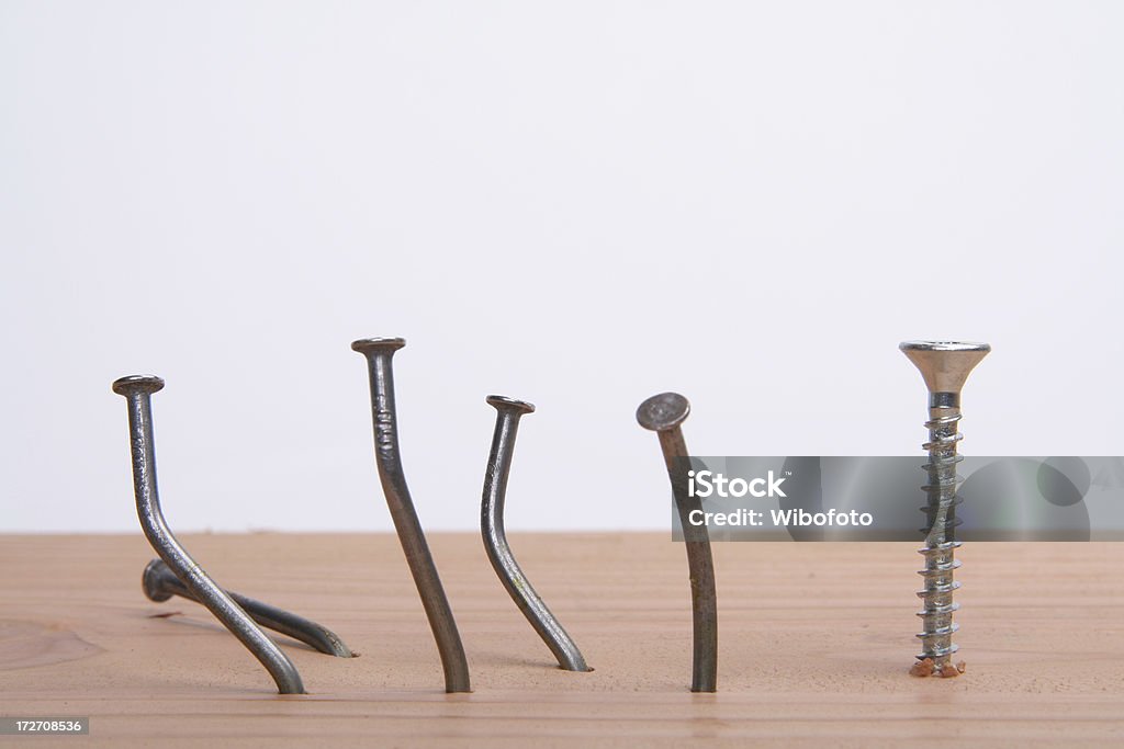 Screw it! Getting frustrated from crooked nails Screw it! Nail - Work Tool Stock Photo