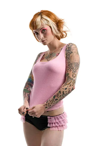 Tattooed woman in Studio.Bright and colorful.