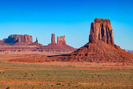 The buttes of iconic Monument Valley on a clear morning.