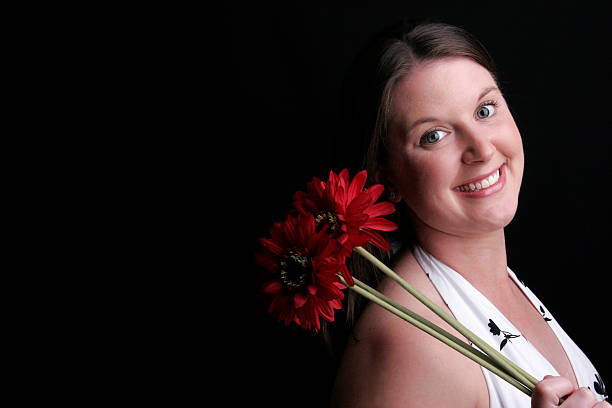 istock smiling woman with flower 172709127