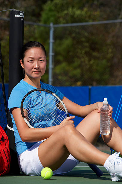 istock Tennis player drinking water between games 172709221