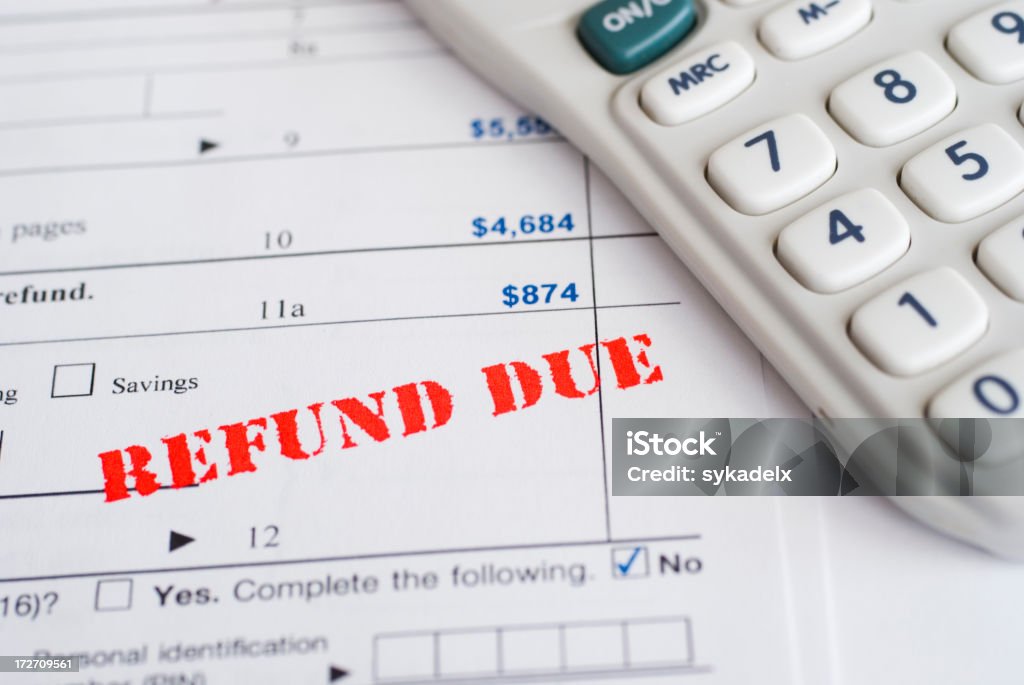 Tax Refund Concept shot of tax form showing amount due with a REFUND DUE stamp. April Stock Photo