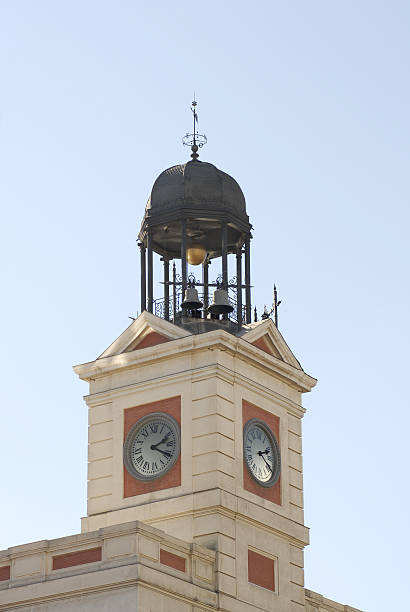 Clock in Puerta del Sol in Madrid, Spain. It is a tradition to take the grapes of luck at the turn of the year the place of the 12 chimes at midnight. (See some similar pictures clicking the images in the LIGHTBOX SPAIN.