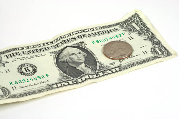 istock Dollar Bill and Quarter is isolated on white 172710895