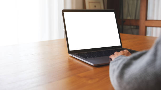 istock Mockup image of a woman using and working on laptop computer with blank white desktop screen 1727109016