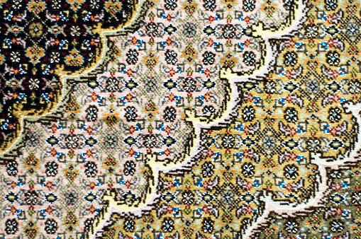 Close-up showing the fine detail of a rug.