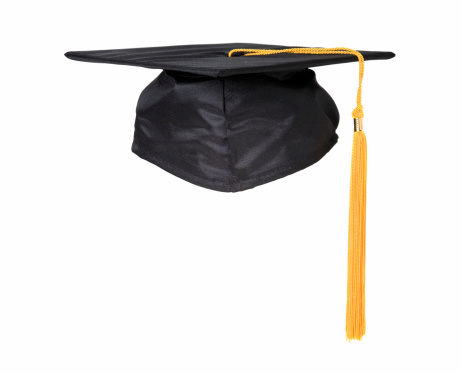 Four hands holding graduation hats on background of blue sky