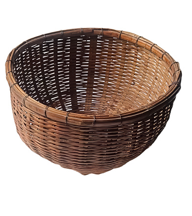 Traditional craftsman made brown wicker basket isolated on a white background. Studio shot.