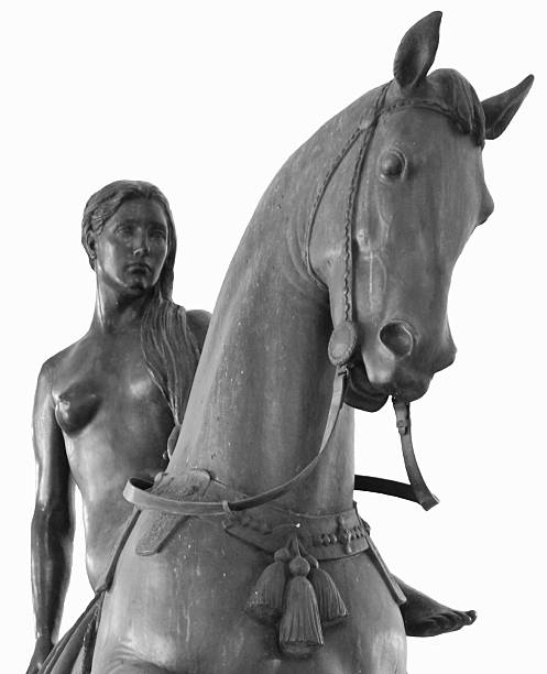 Lady Godiva "The Lady Godiva statue in Coventry, England, isolated on white.  Focus on the horse.UK lightbox" coventry godiva stock pictures, royalty-free photos & images