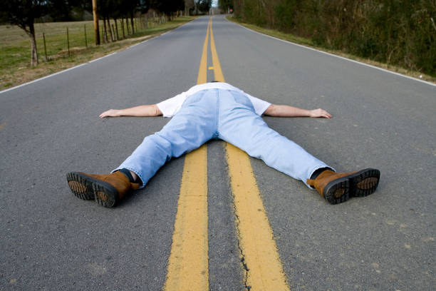 istock Man Face Down In Middle Of Road 172713223