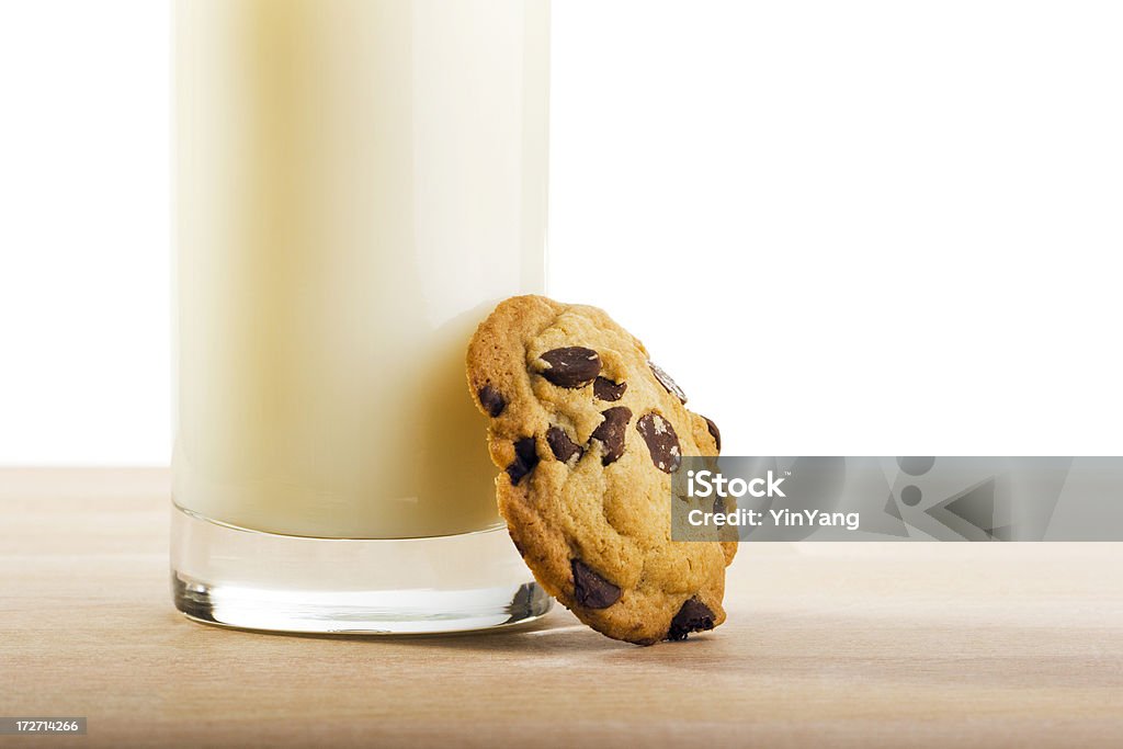 One Chocolate Chip Cookie & Milk Subject: Still life of a chocolate chip cookie and a glass of milk. Baked Stock Photo