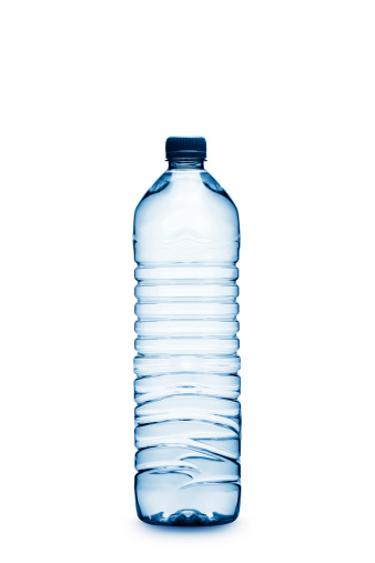 Fresh water in a plastic bottle in front of a white background.