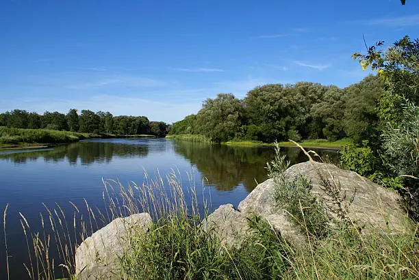 "A calm river on clear summer day. The Grand River in Waterloo, Ontario."