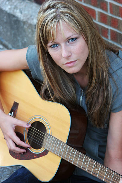 istock Woman playing guitar 172715387