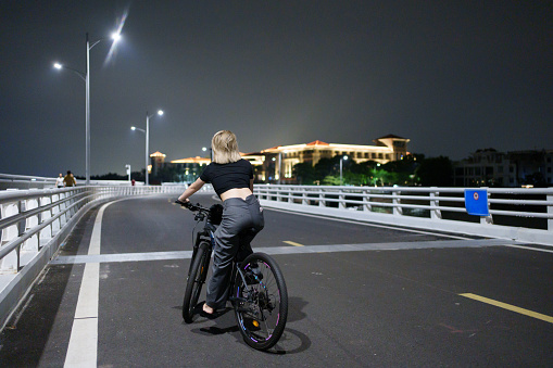 Girl riding outdoors at night