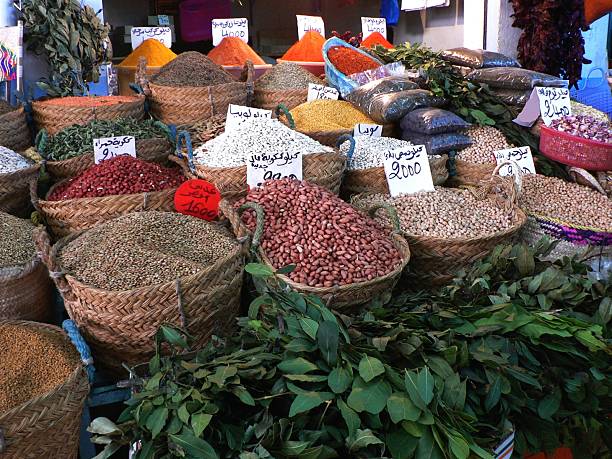 Almonds, apricot, kernel,  dried fruit and spices in large sacks on farmers market.