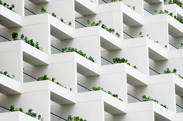 Geometric Balcony Gardens Exclusive balconies adorn a chic building. white buildings stock pictures, royalty-free photos & images