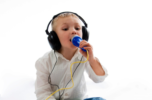 boy with headphones singing into toy microphone Please see some similar pictures from my portfolio: