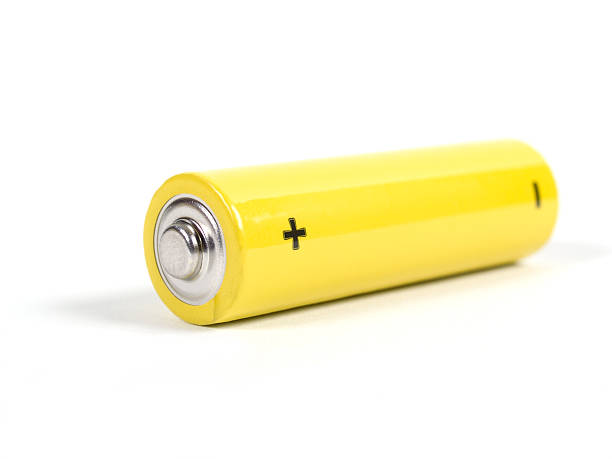 A Close Up Of A Yellow Battery. Copy Space.