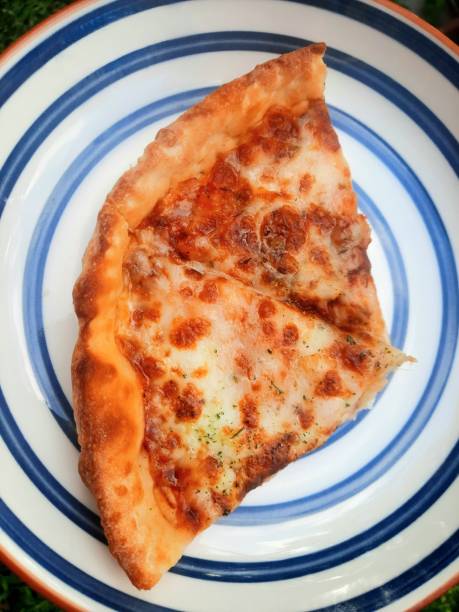 istock 2 Pieces of Pizza on plate. 1727172534
