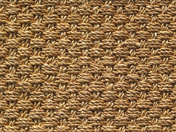 編みこみジュートの織物のラグ背景 ストックフォト