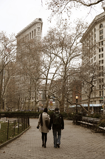 Madison Square Park with flat iron building in background in winter