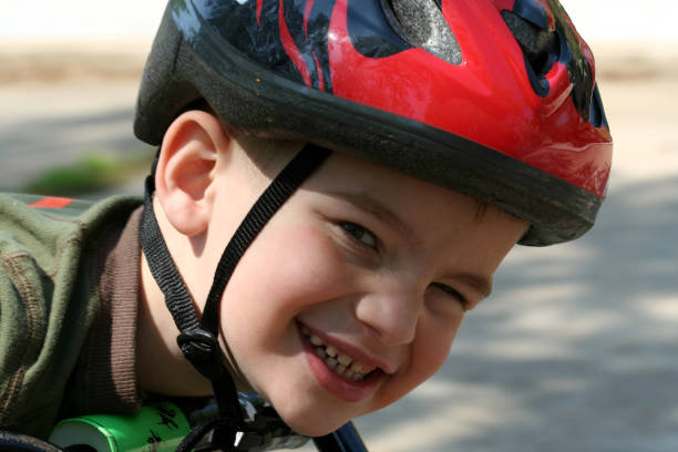 istock Young Boy Wearing Safety Helmet While Riding A Bike 172718682