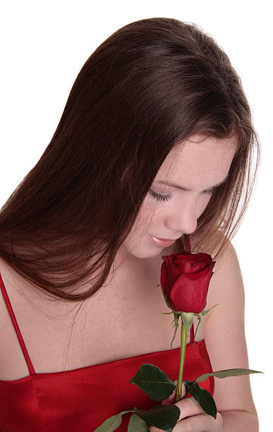 istock Young Woman Smelling A Rose 172719625
