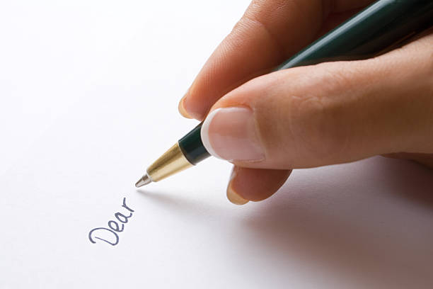 уважаемый (-ая). - letter writing handwriting human hand стоковые фото и изображения