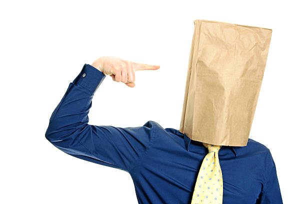 Guy with a paper bag series Guy with a paper bag on his head isolated on white anonymous businessman with paper bag on his head stock pictures, royalty-free photos & images