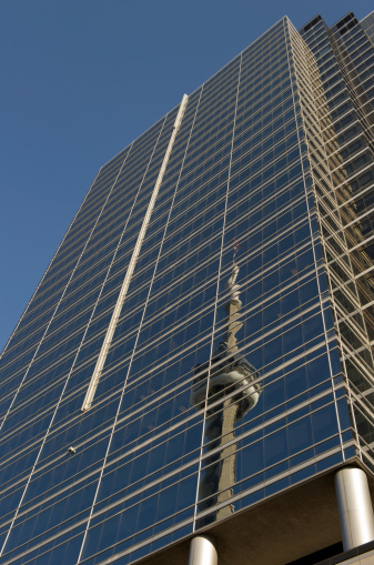 Reflection of CN Tower in office building in downtown district.