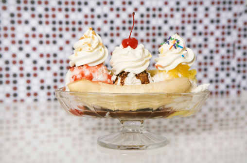 A banana split in front of a polka dots.