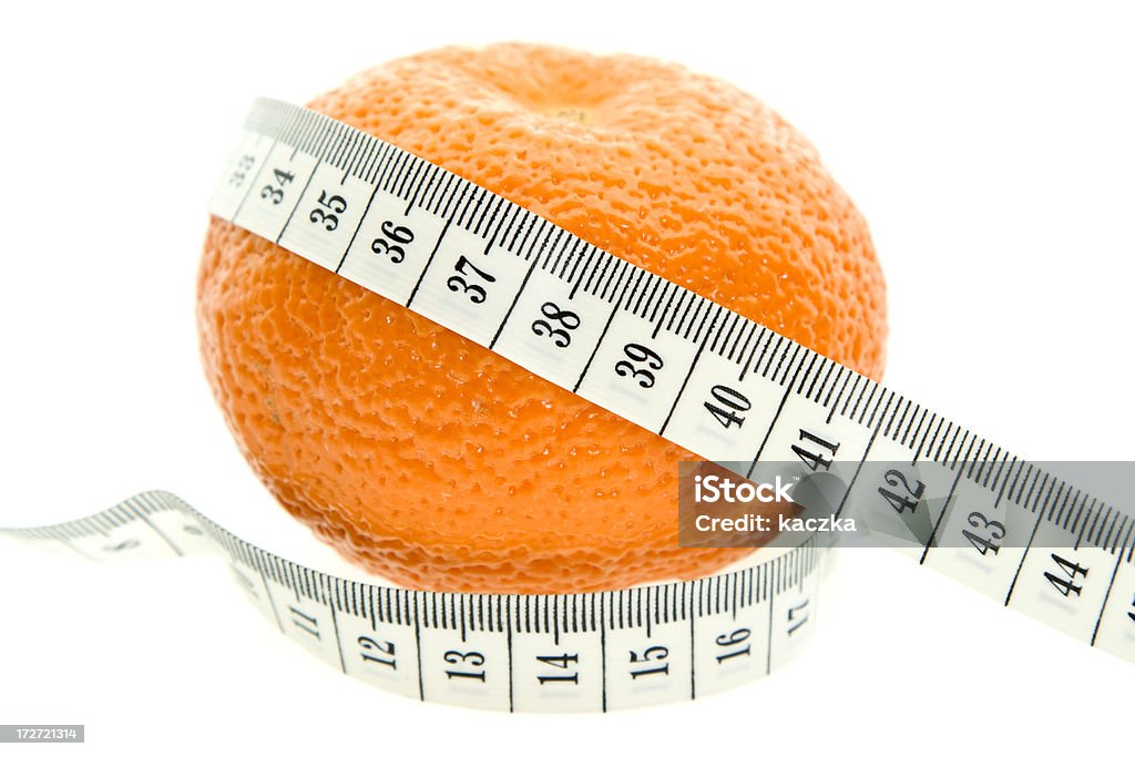 Orange and measuring tape isolated on white Checkout my lightboxes: Beauty Stock Photo