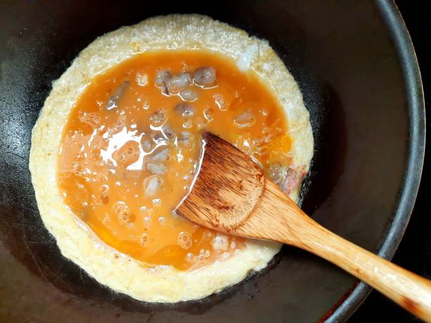 istock Cooking Shrimp Omelet - food preparation. 1727216237